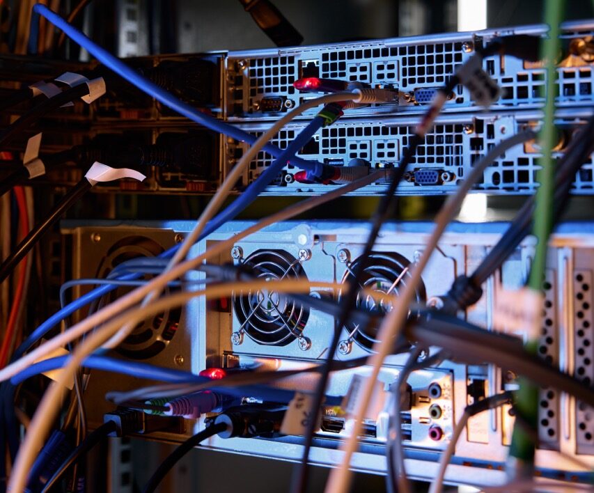Closeup data wires and cables in dark server room