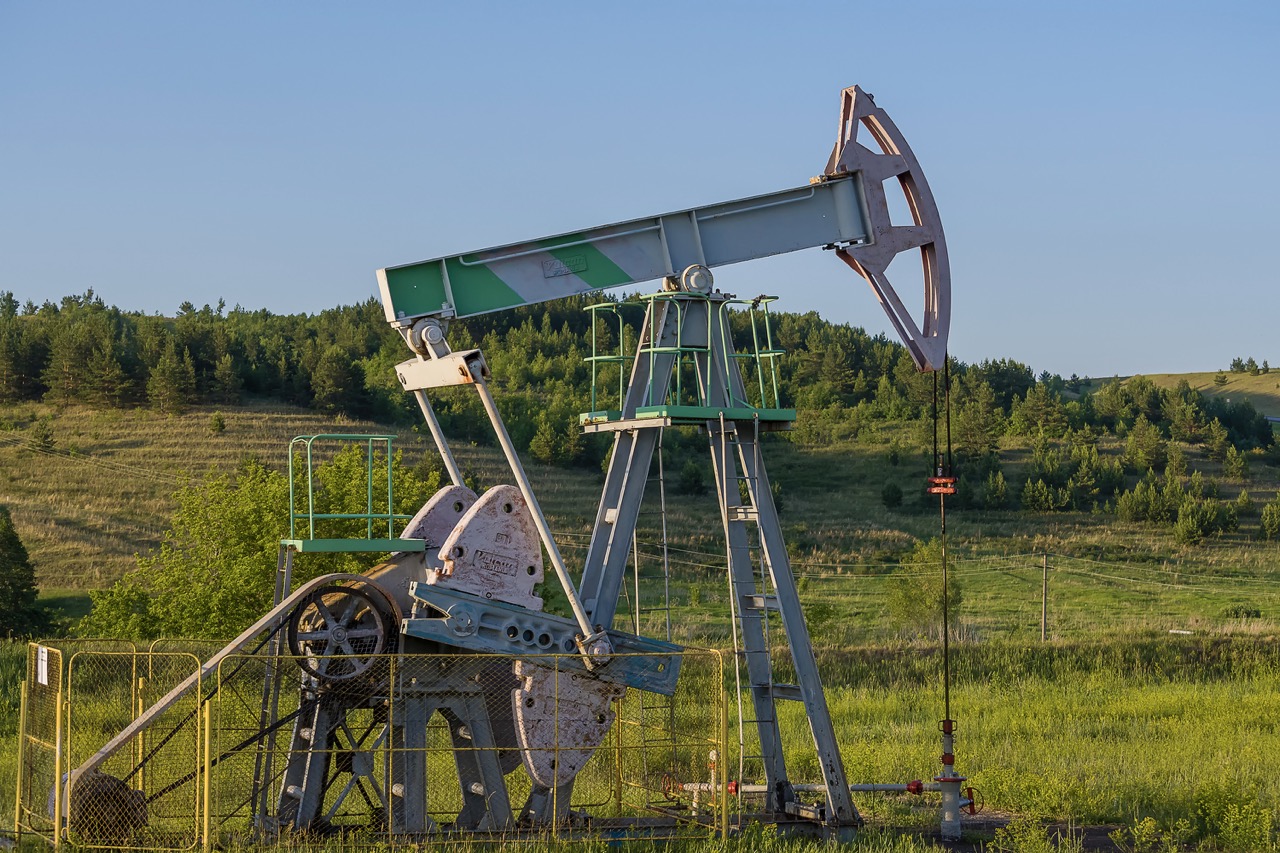 Working oil pump from oil field. Industrial equipment. Bashkortostan, Russia - 12 June, 2021.